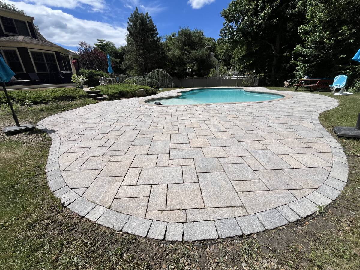 Clean paver pool patio after pressure washing by H2WOAH